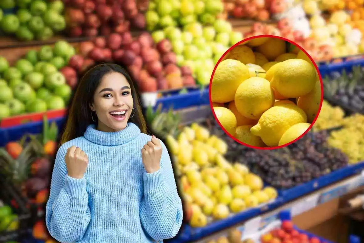 mujer contenta junto a unos limones y una frutería de fondo