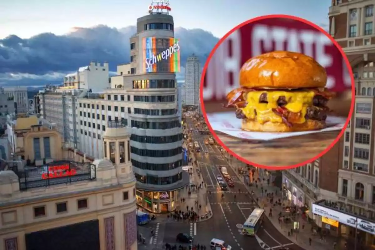 Foto de la ciudad de Madrid con la Torre con el anuncio de Schweppes con un círculo que tiene el borde rojo y una hamburguesa dentro